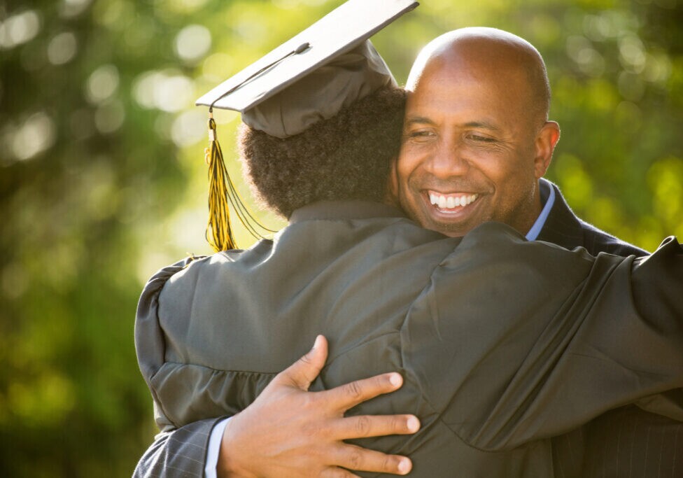 African American father and son at graduation.